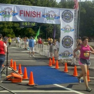 Garage Gym Life co founder Naomi Greaves running through the finish line