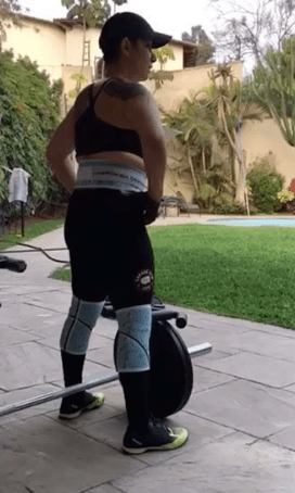 Marisol Swords both lifts weights and practices yoga in her home