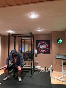 Paul Walsworth prepares for a set in his basement gym