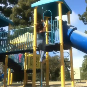 MovNat coach Julie Beck practicing climbing before her birthday