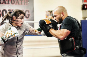 Ross Enamait and WBA World Lightweight Champion Katie Taylor working on the mitts