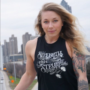 Kristin Pope models a sleeveless t-shirt from her new Strength from Struggle clothing line