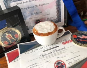 Yolanda Presswood displays her USPA Drug Tested Raw Records certificate