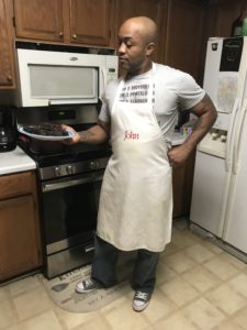 Garage Gym Life founder John Greaves III holding a completed plate of homemade protein brownies