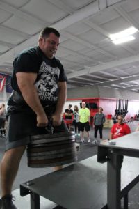 Rocco Walsh doing power stairs in a strongman competition