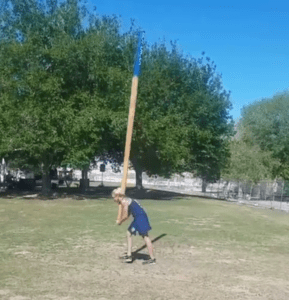 Heidi King enjoys the caber toss