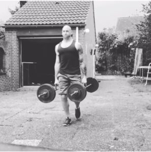 Tim Geurts doing farmers carries as part of his training for obstacle course races and for life