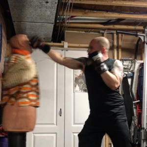 Rich Dlin doing some cardio with the help of a B.O.B. punching dummy